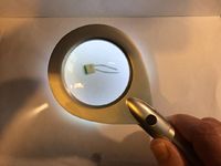 An illuminated magnifying glass