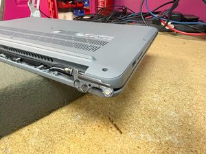 Photograph of Lenovo laptop with broken right hinge